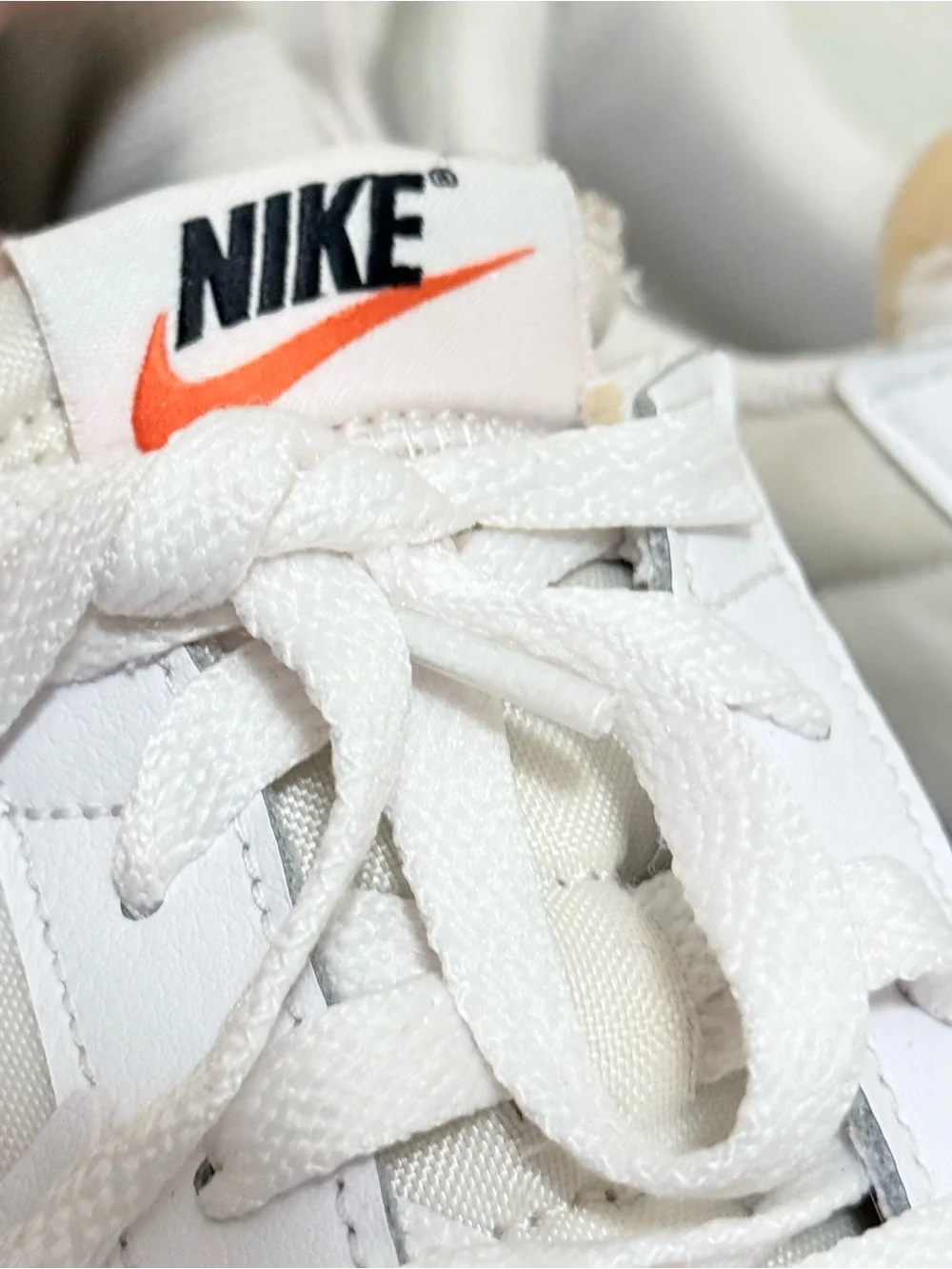 Nike Waffle Debut women’s White Sneakers with Orange Swoosh